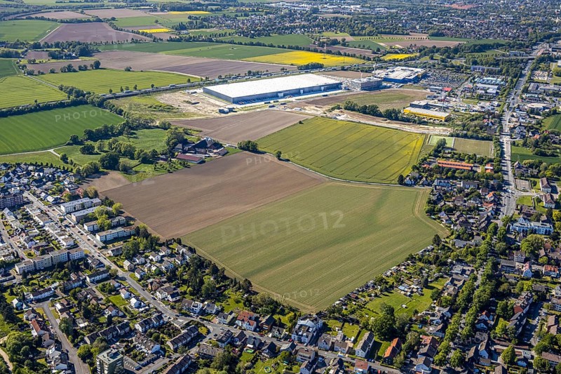 Aerial view, new Woolworth headquarters and logistics centre, commercial area Unna Kamen, Ikea furniture store, Unna, Ruhr area, North Rhine-Westphalia, Germany, A1 motorway, DE, Europe, commercial enterprises, commercial area, commercial park, commercial location, commercial use, freight traffic, industrial area, industrial location, logistics, logistics centre, aerial view, aerial photography, aerial photography, overview, bird's-eye view, meadows and fields, birds-eyes view, overview