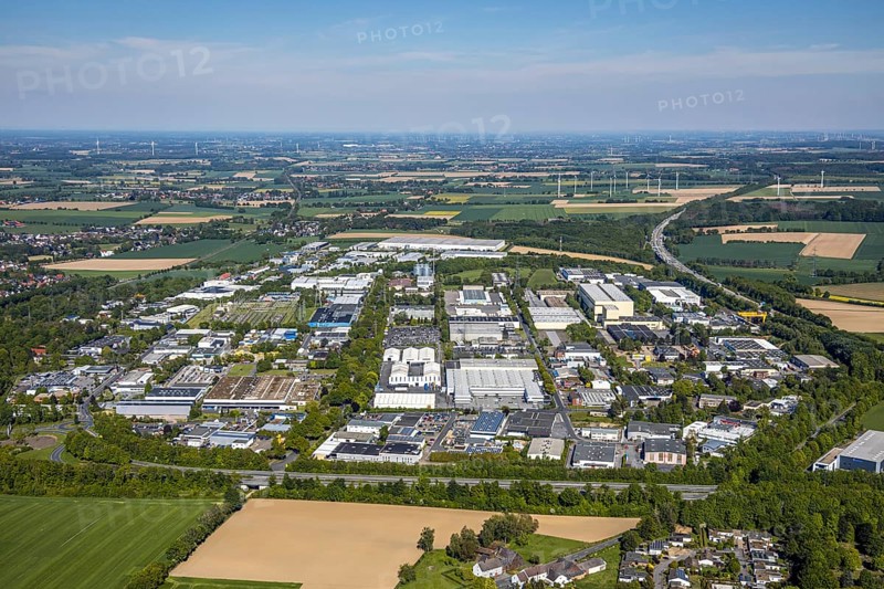 Aerial view, industrial park Unna-Ost, Unna, Ruhr area, North Rhine-Westphalia, Germany, motorway A44, DE, energy, Europe, distant view, commercial enterprises, commercial area, commercial park, commercial location, commercial use, industrial plants, industrial area, industrial location, aerial photograph, aerial photography, aerial photography, overview, bird's-eye view, WTG, meadows and fields, wind energy plant, wind power, wind turbine, wind farm, wind turbines, bird's-eye view, overview