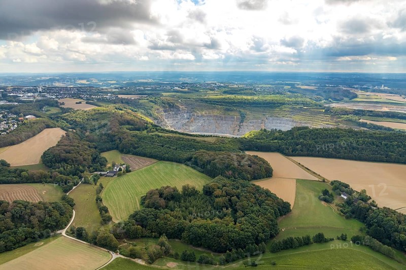 Aerial view, quarry Rützkausen, city border Velbert Wülfrath, limestone quarry, Wülfrath, Ruhr area, North Rhine-Westphalia, Germany, DE, Europe, aerial view, aerial photography, aerial photography, quarry, overview, Velbert, bird's-eye view, forest area, meadows and fields, cloud formation, birds-eyes view, overview, Velbert-Mitte
