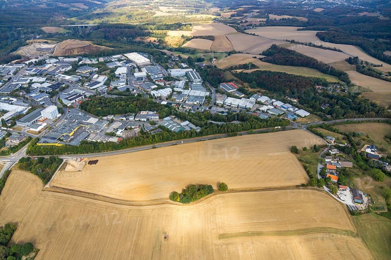 Aerial view, industrial area Röbbeck, Stahlstraße, farmland Großes Feld, planned industrial area, Langenberger Straße, construction site, spoil heap Zechenweg, Hefel, Röbbeck, Velbert, Ruhr area, North Rhine-Westphalia, Germany, spoil heap, motorway A44, motorway bridge, bridge, DE, Europe, distant view, commercial enterprises, commercial area, commercial area, commercial park, commercial location, commercial use, Hesperbach, industrial area, industrial location, aerial view, aerial photography, aerial photography, nature reserve, overview, bird's-eye view, forest area, meadows and fields, birds-eyes view, onlyVelbert, overview, Velbert-Mitte