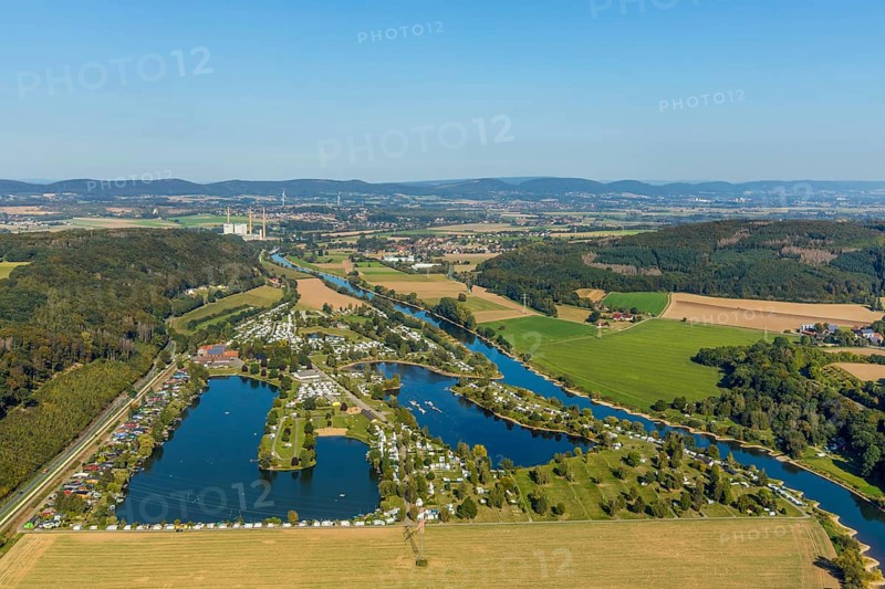 Aerial photo, family campsite Borlefzen, river Weser, Uffeln, Vlotho, OWL, Ostwestfalen-Lippe, East Westphalia, North Rhine-Westphalia, Germany, bathing lake, boats, boat harbour, Borlefzener Hof, camping, camping facility, camping houses, camping mobile, camping site, DE, Europe, distant view, leisure, hobby, Veltheim power station, aerial view, aerial photography, aerial photography, OWL book, OWL book, lake, sailing boats, overview, bird's-eye view, motorhome, caravan, marina, birds-eyes view, overview, decommissioned power station