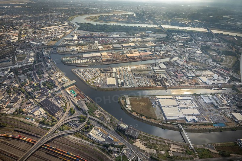 Aerial photo, harbour area, harbour facilities, Obererft, Neuss, city limits Düsseldorf, Rhineland, North Rhine-Westphalia, Germany, DE, Europe, birds-eyes view, aerial photo, aerial photography, aerial photography, overview, bird's eye view, harbour operating company, Neuss-Düsseldorfer Häfen GmbH & Co. KG, Contargo Neuss GmbH, Spedition Ansorge GmbH & Co. KG, Tanquid GmbH & Co. KG Tanklager Neuss I, Neuss customs office, Rhine, car transport, car loading, cargo ships, Neuss port, port of Neuss, port of Neuss, Rhine port, inland port, port facility, inland shipping