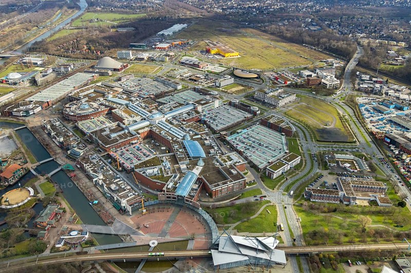Aerial view, Centro shopping centre, new building POCO Einrichtungsmarkt, yellow-red building, Oberhausen, Ruhr area, North Rhine-Westphalia, Germany, DE, shopping centre, shopping mall, shopping mile, shopping markets, shopping square, shopping centre, Europe, canal on the promenade, aerial view, aerial photography, aerial photography, furniture shop, local supply centre, Neue Mitte, shopping, overview, bird's eye view, birds-eyes view, overview