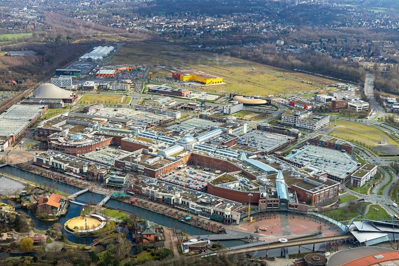 Aerial view, Centro shopping centre, new building POCO Einrichtungsmarkt, yellow-red building, Oberhausen, Ruhr area, North Rhine-Westphalia, Germany, DE, shopping centre, shopping mall, shopping mile, shopping markets, shopping square, shopping centre, Europe, canal on the promenade, aerial view, aerial photography, aerial photography, furniture shop, local supply centre, Neue Mitte, shopping, overview, bird's eye view, birds-eyes view, overview