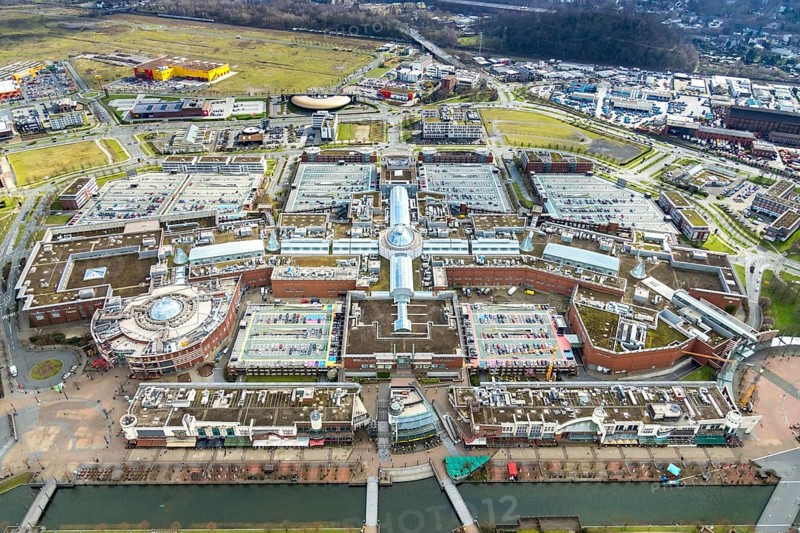 Aerial view, Centro shopping centre, Oberhausen, Centro-Promenade, Ruhr area, North Rhine-Westphalia, Germany, DE, shopping centre, shopping mall, shopping mile, shopping markets, shopping square, shopping centre, Europe, shapes and colours, canal on the promenade, aerial view, aerial photography, aerial photography, furniture shop, local supply centre, Neue Mitte, shopping, overview, bird's eye view, birds-eyes view, overview