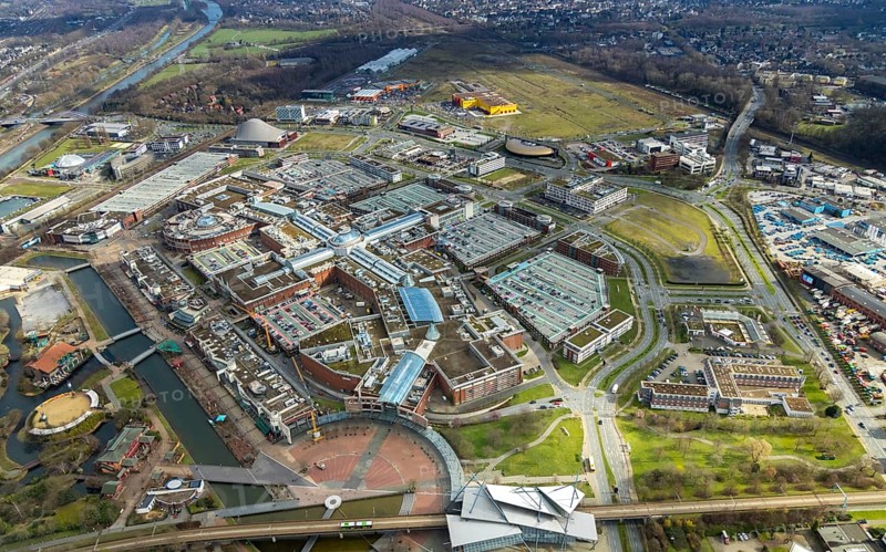 Aerial view, Centro shopping centre, new building POCO Einrichtungsmarkt, yellow-red building, Oberhausen, Ruhr area, North Rhine-Westphalia, Germany, DE, shopping centre, shopping mall, shopping mile, shopping markets, shopping square, shopping centre, Europe, canal on the promenade, aerial view, aerial photography, aerial photography, furniture shop, local supply centre, Neue Mitte, shopping, overview, bird's eye view, birds-eyes view, overview