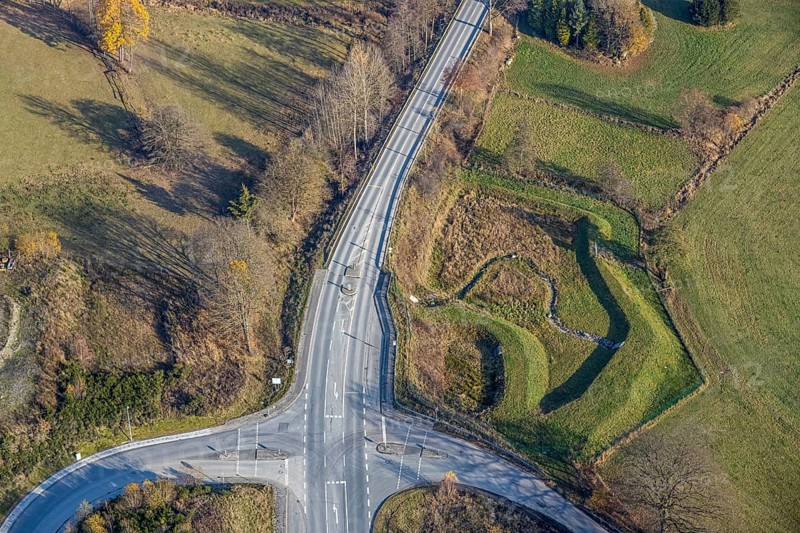 Aerial view, federal road B511 intersection Buchenweg, at the industrial park Hochsauerland, Wormbach, Schmallenberg, Sauerland, North Rhine-Westphalia, Germany, DE, Europe, shapes and colours, intersection, aerial photograph, aerial photography, aerial photography, road traffic, overview, bird's-eye view, birds-eyes view, overview