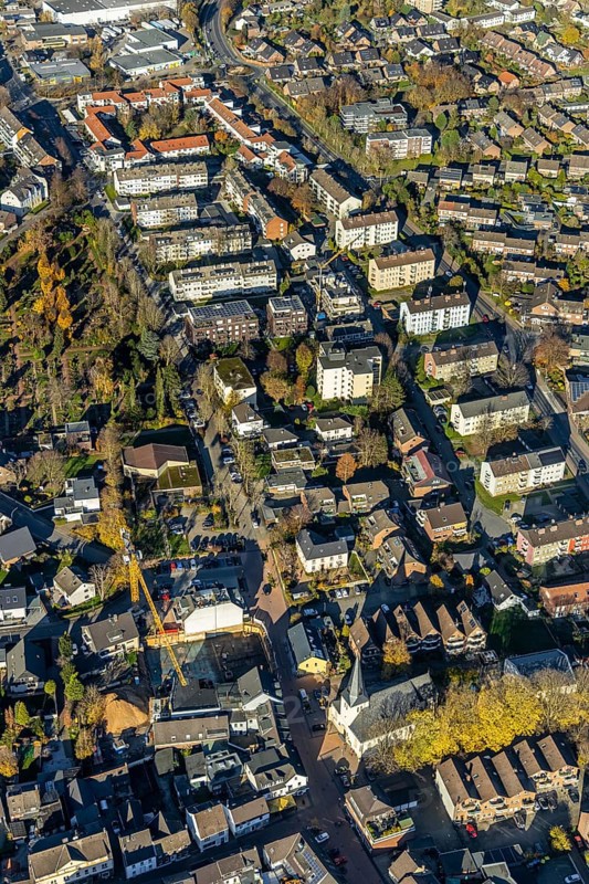 Aerial view, view of Neukirchen, Hochstraße, Andreas-Bräm-Straße, village church, residential buildings, Evang. Cemetery, Neukirchen, Neukirchen-Vluyn, Ruhr area, North Rhine-Westphalia, Germany, place of worship, construction work, building, construction area, building site, building plots, construction project, construction site, burial ground, DE, Europe, cemetery, memorial site, religious community, place of worship, place of worship, land tax, graves, burial ground, holy place, real estate, church, parish, denomination, aerial view, aerial photography, aerial photography, new building, town view, terraced houses, religion, religious site, resting place, townscape, overview, bird's-eye view, housing estate, housing and living, residential area, housing quality, residential neighbourhood, housing estate, birds-eyes view, overview