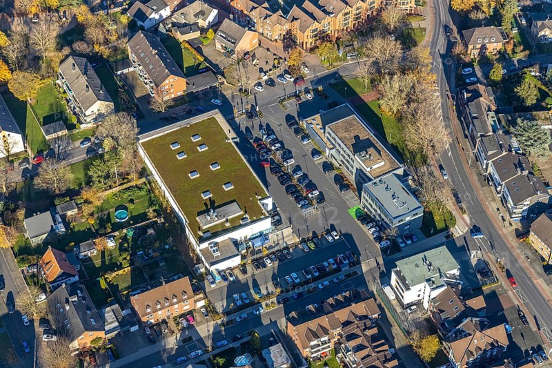 Aerial view, Edeka supermarket, Mozartstraße, Alte Rathausstraße, Andreas-Bräm-Haus, Neukirchener Erziehungsverein, Neukirchen, Neukirchen-Vluyn, Ruhr area, North Rhine-Westphalia, Germany, DE, shopping centre, shopping markets, shopping place, shopping mall, Europe, aerial view, aerial photography, aerial photography, local supply centre, shopping centre, supermarket, overview, bird's eye view, birds-eyes view, overview