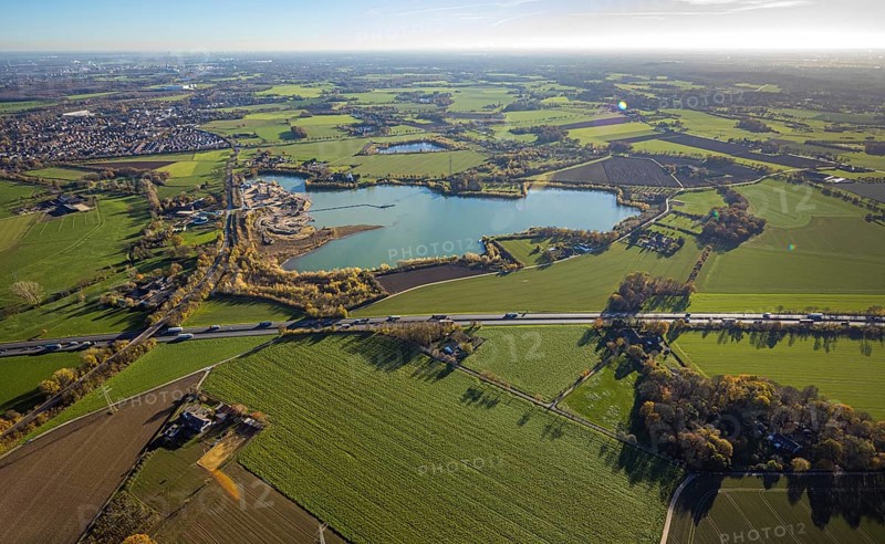 Aerial view, Krefelder Straße quarry pond, meadows and fields, Neukirchen, Neukirchen-Vluyn, Ruhr area, North Rhine-Westphalia, Germany, An der Neuen Mühle, motorway A40, Carl Risch GmbH, DE, Europe, aerial view, aerial photography, aerial photography, mill, lake, overview, bird's-eye view, overview
