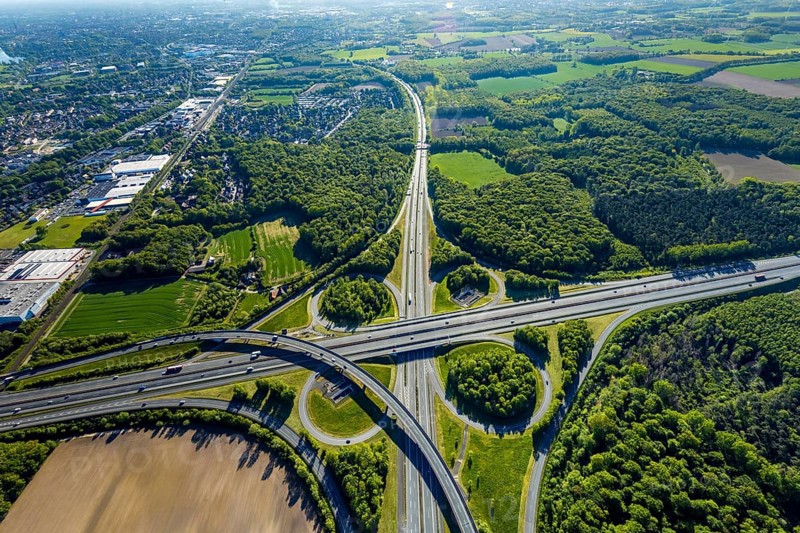 Aerial view, motorway junction Münster-Süd, motorway A1, motorway A43, Münster, Münsterland, North Rhine-Westphalia, Germany, motorway, motorway bridge, motorway junction, greening, DE, Europe, shapes and colours, freight traffic, landscape forms, aerial view, aerial photography, aerial photography, road traffic, overview, traffic, traffic volume, bird's-eye view, forest area, meadows and fields, birds-eyes view, overview