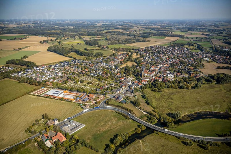 Aerial view, river Lippe, Lippe meadows, nature reserve, bridge Heintroper Straße over the Lippe, view of Lippborg, Lippetal, district Soest, North Rhine-Westphalia, Germany, place of worship, federal road B475, DE, Europe, religious community, place of worship, main street, church, parish, denomination, Kreis-Soest-Buch, KreisSoestBuch, aerial photography, aerial photography, NSG, nature conservation, religion, overview, environmental protection, bird's-eye view, meadows and fields, meadows and pastures, birds-eyes view, catholic church of St. Cornelius and St. Cyprelius, church of St. Cyprelius and St. Cyprelius Church of St Cornelius and Cyprian, national nature reserve, overview