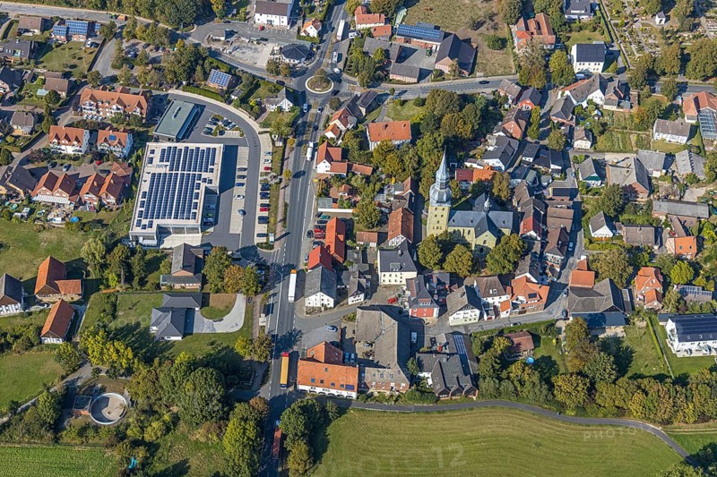 Aerial view, local view, St. Stephanus Kirche, Oestinghausen, Lippetal, Kreis Soest, North Rhine-Westphalia, Germany, Aldi Supermarkt Neubau, Andachtstätte, DE, Europe, Glaubensgemeinschaft, Gotteshaus, Grundsteuer, Immobilien, Innenstadt, Kirche, Kirchengemeinde, Konfession, Kreis-Soest-Buch, KreisSoestBuch, Kreisverkehr, aerial view, aerial photography, aerial photography, photovoltaic, photovoltaic system, religion, solar, solar system, solar energy, solar energy, city centre, overview, bird's-eye view, residential area, residential buildings, residential quality, residential quarter, housing estate, birds-eyes view, overview