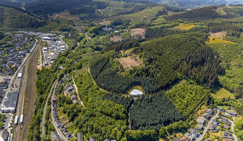 Aerial view, Lennestadt-Altenhundem railway station, construction site in the forest sports field GymSL, Altenhundem, Lennestadt, Sauerland, North Rhine-Westphalia, Germany, DE, Europe, hilly landscape, aerial view, aerial photography, aerial photography, sports field, sports facility, overview, under the cliffs, bird's eye view, forest area, birds-eyes view, overview