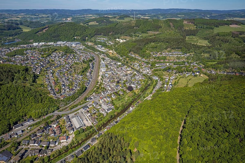 Aerial view, view of Meggen, Lennestadt-Meggen railway station, Rayonex Biomedical GmbH, Franziskus-Schule Meggen, DITIB Yesil Mosque Lennestadt, Catholic Church St. Bartholomäus, Meggen, Lennestadt, Sauerland, North Rhine-Westphalia, Germany, place of worship, railway tracks, railway station, burial site, education, educational institution, DE, Deutsche Bahn AG, Europe, distant view, cemetery, Meggen cemetery, Schützenhof restaurant, memorial, religious community, churchyard, place of worship, property tax, cemetery, hilly landscape, real estate, church, parish, denomination, educational institution, aerial view, aerial photography, aerial photography, resting place, school, overview, bird's-eye view, housing estate, living and life, residential area, residential buildings, residential quality, housing estate, birds-eyes view, overview, wladg