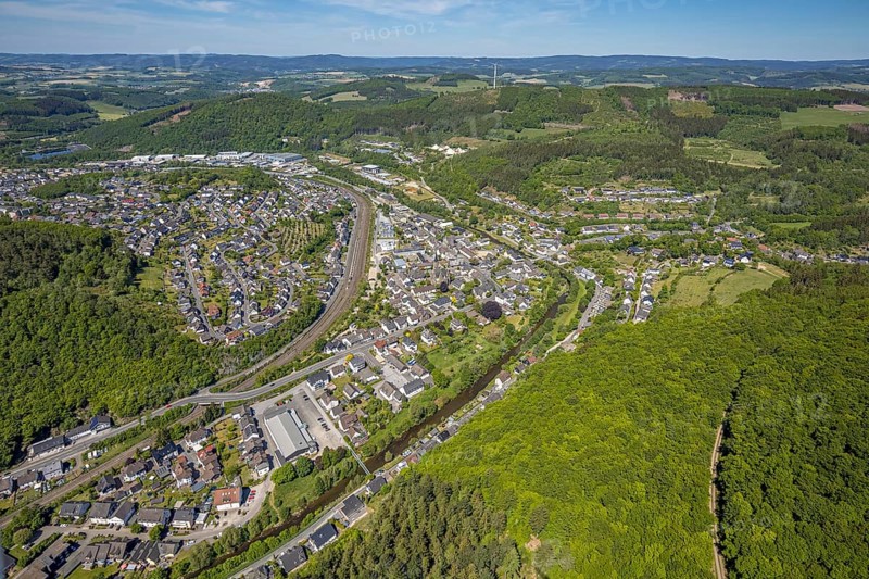 Aerial view, view of Meggen, Lennestadt-Meggen railway station, Rayonex Biomedical GmbH, Franziskus-Schule Meggen, DITIB Yesil Mosque Lennestadt, Catholic Church St. Bartholomäus, Meggen, Lennestadt, Sauerland, North Rhine-Westphalia, Germany, place of worship, railway tracks, railway station, burial site, education, educational institution, DE, Deutsche Bahn AG, Europe, distant view, cemetery, Meggen cemetery, Schützenhof restaurant, memorial, religious community, churchyard, place of worship, property tax, cemetery, hilly landscape, real estate, church, parish, denomination, educational institution, aerial view, aerial photography, aerial photography, resting place, school, overview, bird's-eye view, housing estate, living and life, residential area, residential buildings, residential quality, housing estate, birds-eyes view, overview, wladg