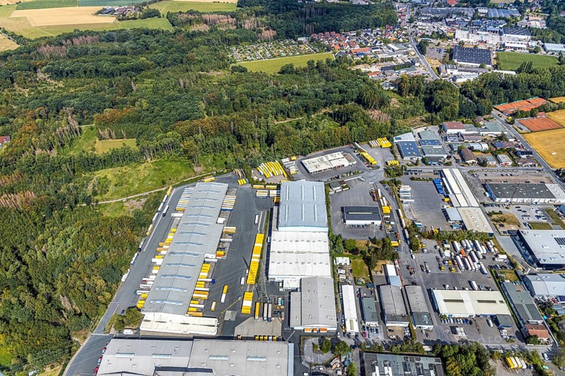 Aerial view, Meisenweg industrial estate, DHL Freight GmbH, Menden, Sauerland, Märkischer Kreis, North Rhine-Westphalia, Germany, DE, Europe, freight forwarding service, commercial enterprises, commercial area, commercial park, commercial location, commercial use, freight traffic, industrial area, industrial location, logistics, logistics service, logistics service provider, logistics provider, logistics centre, aerial photograph, aerial photography, aerial photography, freight forwarding, transport, transport service, overview, bird's eye view, birds-eyes view, overview