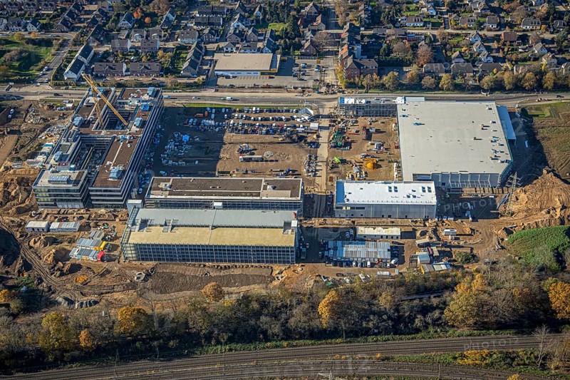 Aerial view, construction site, new Edeka headquarters, Rheinberger Straße, Rheinkamp-Utfort, Mörs, Ruhr area, North Rhine-Westphalia, Germany, construction work, construction, construction area, building site, building plots, construction project, construction site, DE, Edeka Markt, Europe, aerial view, aerial photography, aerial photography, new building, overview, administration, bird's eye view, birds-eyes view, overview