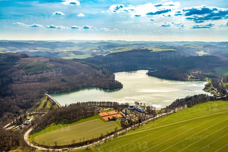 Aerial view, Hennetalsperre, Hennesee, Welcome Hotel Meschede Hennesee, Meschede, Sauerland, North Rhine-Westphalia, Germany, DE, food and drink, Europe, distant view, shapes and colours, inn, gastronomy, Hennedamm, hotel, hotel facilities, hotel industry, hilly landscape, landscape panorama, aerial view, aerial photography, aerial photography, mixed forest, coniferous forest, sport, dam wall, reservoir, dam, tennis, tennis facility, tennis courts, overview, bird's-eye view, forest, forest area, forest dieback, Welcome Hotel Meschede/Hennesee, birds-eyes view, overview