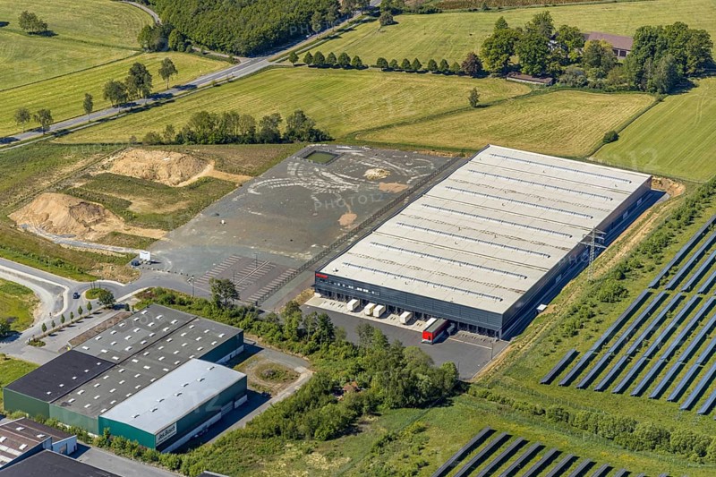 Aerial view, industrial estate Enste Nord, new building logistics centre Briloner Leuchten GmbH, Meschede, Sauerland, North Rhine-Westphalia, Germany, motorway A46, motorway junction Enste, DE, Europe, commercial enterprises, commercial area, industrial estate, commercial park, commercial location, commercial use, Hochsauerlandkreis, industrial area, industrial location, aerial view, aerial photography, aerial photography, solar park Enste, overview, bird's-eye view, overview