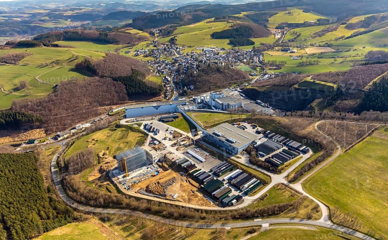 Aerial view, View of Grevenstein, Brewery C.& A. VELTINS GmbH & Co. KG, new high-bay warehouse, Grevenstein, Meschede, Sauerland, North Rhine-Westphalia, Germany, An der Streue, construction work, construction site, construction crane, construction measure, construction project, construction site, brewery, DE, Europe, beverage manufacturer, property tax, hilly landscape, real estate, capacity requirement, aerial view, aerial photography, aerial photography, new building, overview, Veltins, bird's-eye view, forest area, meadows and fields, housing estate, living and living, residential area, residential buildings, quality of living, birds-eyes view, overview