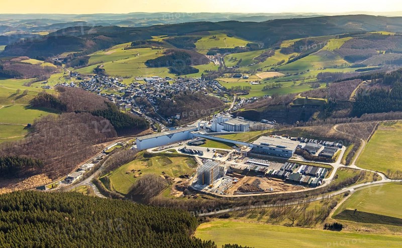 Aerial view, View of Grevenstein, Brewery C.& A. VELTINS GmbH & Co. KG, new high-bay warehouse, Grevenstein, Meschede, Sauerland, North Rhine-Westphalia, Germany, An der Streue, construction work, construction site, construction crane, construction measure, construction project, construction site, brewery, DE, Europe, beverage manufacturer, property tax, hilly landscape, real estate, capacity requirement, aerial view, aerial photography, aerial photography, new building, overview, Veltins, bird's-eye view, forest area, meadows and fields, housing estate, living and living, residential area, residential buildings, quality of living, birds-eyes view, overview