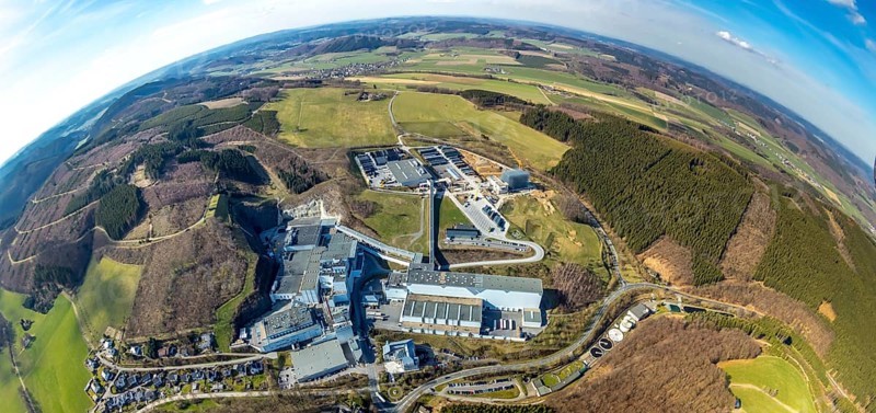 Aerial view, Brewery C.& A. VELTINS GmbH & Co. KG, new high-bay warehouse, super wide angle, Grevenstein, Meschede, Sauerland, North Rhine-Westphalia, Germany, An der Streue, construction work, construction site, construction crane, construction measure, construction project, construction site, brewery, DE, earth curvature, Europe, fisheye image, beverage manufacturer, hilly landscape, capacity requirement, aerial view, aerial photography, aerial photography, new building, super wide angle, overview, Veltins, bird's eye view, forest area, meadows and fields, birds-eyes view, overview