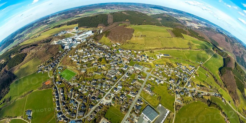 Aerial view, View of Grevenstein, Brewery C.& A. VELTINS GmbH & Co. KG, new high-bay warehouse, super wide angle, Grevenstein, Meschede, Sauerland, North Rhine-Westphalia, Germany, An der Streue, construction work, construction site, construction crane, construction measure, construction project, construction site, brewery, DE, earth curvature, Europe, fisheye image, beverage manufacturer, property tax, hilly landscape, real estate, capacity requirement, aerial view, aerial photography, aerial photography, new building, super wide angle, overview, Veltins, bird's eye view, forest area, meadows and fields, residential complex, living and life, residential area, residential buildings, quality of life, birds-eyes view, overview