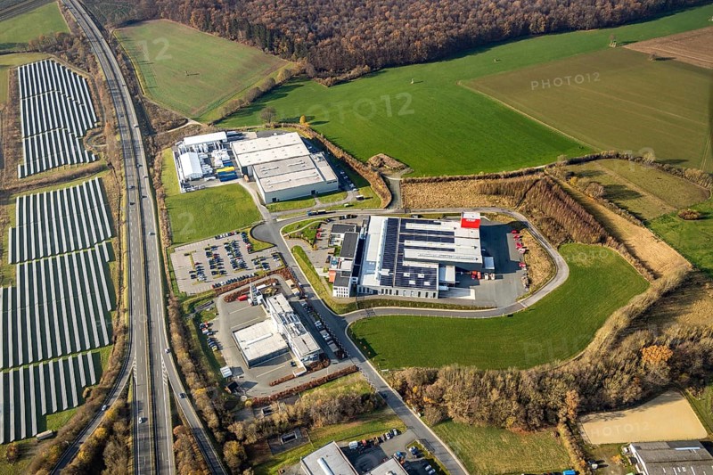 Aerial view, industrial estate Enste-Nord, Maschinenbau SH Anbaugeräte GmbH, Enste, Meschede, Sauerland, North Rhine-Westphalia, Germany, motorway A46, motorway junction Enste, DE, Europe, commercial enterprises, commercial area, commercial area, commercial park, commercial location, commercial use, industrial area, industrial location, aerial view, aerial photography, aerial photography, photovoltaics, photovoltaic system, solar, solar system, solar energy, solar park Enste, overview, bird's-eye view, bird's-eye view, overview