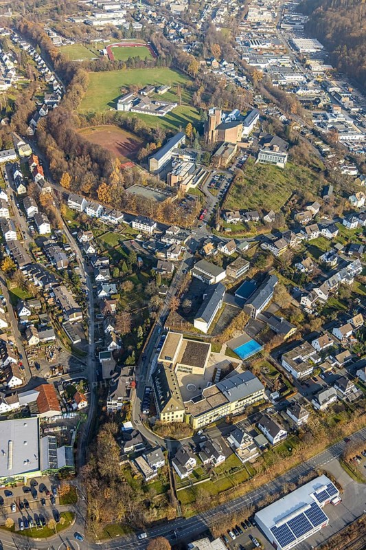 Aerial view, St. Walburga-Realschule, Kloster Abtei Königsmünster mit Gymnasium der Benediktiner, Klosterberg, Meschede-Stadt, Meschede, Sauerland, North Rhine-Westphalia, Germany, abbey, place of worship, education, educational institution, DE, Europe, religious community, place of worship, grammar school, house of silence, holy place, church, parish, monastery, denomination, aerial view, aerial photography, aerial photography, secondary school, religion, religious site, school, sports field, towers, overview, bird's-eye view, forest area, birds-eyes view, catholic church of the Assumption of the Blessed Virgin Mary Church of the Assumption of the Virgin Mary Meschede, overview