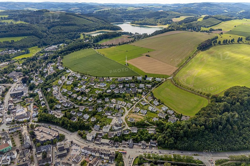 Aerial view, town view, Meschede, planned building area near Langelohweg, Hennesee, Hennetalsperre, Sauerland, Hochsauerlandkreis, North Rhine-Westphalia, Germany, building area, mountains and valleys, city, DE, Europe, radio tower, property tax, hilly landscape, real estate, aerial view, aerial photography, aerial photography, Schröershof holiday home rental, townscape, city area, overview, bird's-eye view, forest area, meadows and fields, residential area, living and life, residential area, quality of life, birds-eyes view, overview