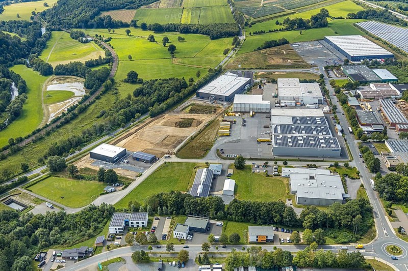 Aerial view, construction site new building Lausberg Kunststofftechnik, industrial estate Meschede-Enste, Am Heerweg, Meschede, Sauerland, Hochsauerlandkreis, North Rhine-Westphalia, Germany, construction work, construction area, building site, building plots, construction project, construction site, Caritas-Werkstätten Meschede, DE, Europe, commercial enterprises, commercial area, commercial park, commercial site, commercial use, industrial area, industrial site, L743 state road, Lausberg, Lausberg Kunststofftechnik, aerial photograph, aerial photography, aerial photography, MÖNIG Spedition, new building, R.A.B.E. waste processing, overview, bird's-eye view, birds-eyes view, overview
