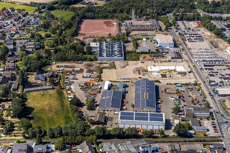 Aerial view, construction site ENNI factory and administration building, former carpentry Cleve, recycling centre, fire brigade Mörs, fire brigade Hülsdonk, building with solar roofs, Mörs, Ruhr area, North Rhine-Westphalia, Germany, DE, Europe, birds-eyes, view, aerial view, aerial photography, aerial photography, overview, bird's eye view, administration building, fire station, rescue service, fire engine, fire fighting, emergency supply