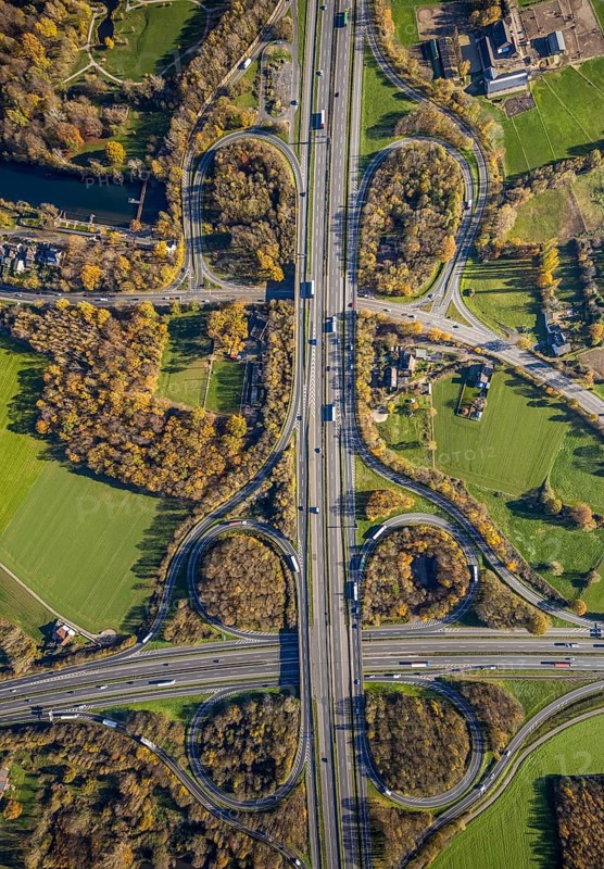 Aerial view, motorway junction Mörs, A40, A57, Moers-Hülsdonk, Mörs, Ruhr area, North Rhine-Westphalia, Germany, motorway A40, motorway A57, motorway junction, DE, Europe, shapes and colours, green trees, autumn colours, aerial view, aerial photography, aerial photography, overview, bird's-eye view, overview