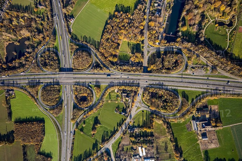 Aerial view, motorway junction Mörs, A40, A57, Moers-Hülsdonk, Mörs, Ruhr area, North Rhine-Westphalia, Germany, motorway A40, motorway A57, motorway junction, DE, Europe, shapes and colours, green trees, autumn colours, aerial view, aerial photography, aerial photography, overview, bird's-eye view, overview