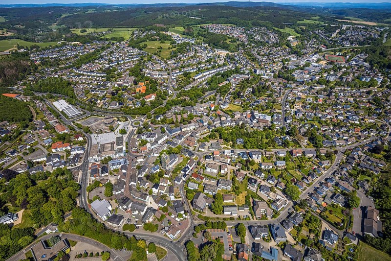 Aerial view, town view, town hall, construction site renovation Jesus-Christus-Kirche, Meinerzhagen, Märkischer Kreis, Sauerland, North Rhine-Westphalia, Germany, place of worship, construction work, construction project, city, DE, Europe, distant view, religious community, place of worship, hilly landscape, city centre, church, parish, denomination, roundabout, culture, art, aerial view, aerial photography, aerial photography, renovation, redevelopment, townscape, city area, city centre, overview, events, event location, event venue, event centre, bird's-eye view, residential area, birds-eyes view, cultural use, overview