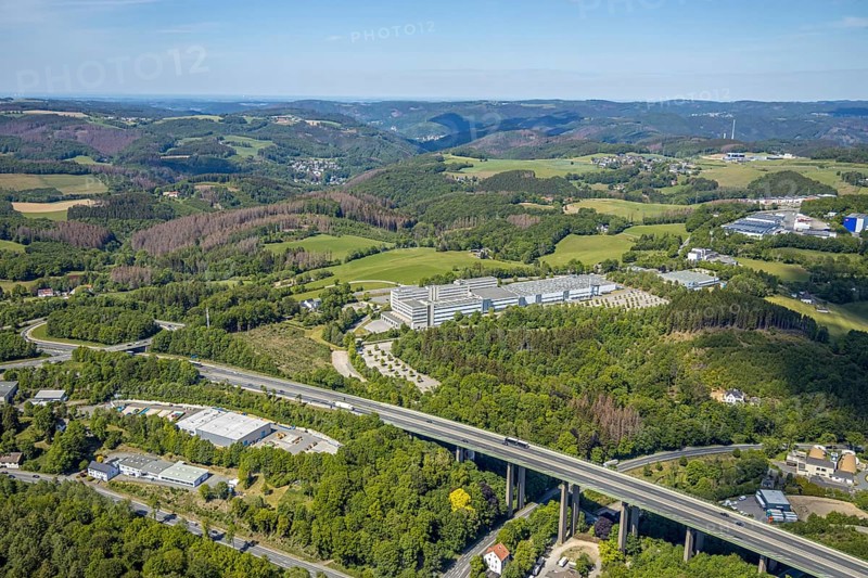 Aerial view, Leopold Kostal GmbH & Co. KG, An der Bellmerei, motorway A45, Lüdenscheid, Märkischer Kreis, Sauerland, North Rhine-Westphalia, Germany, motorway, DE, Europe, distant view, commercial area, commercial use, industrial plants, industrial area, industrial site, Kostal, aerial photograph, aerial photography, aerial photography, car parks, production plants, production halls, overview, traffic, bird's-eye view, forest area, birds-eyes view, overview