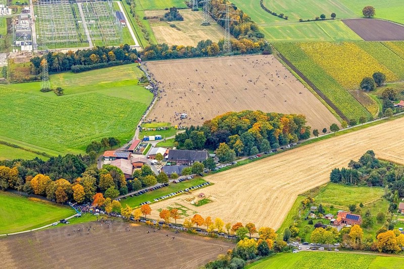 Aerial photo, thousands of spectators watched with great interest as the Gersteinwerk chimney was blown up half an hour late. The 282 metre high RWE chimney fell exactly into the prepared gravel bed. City limits of Werne, Hamm North Rhine-Westphalia, Germany