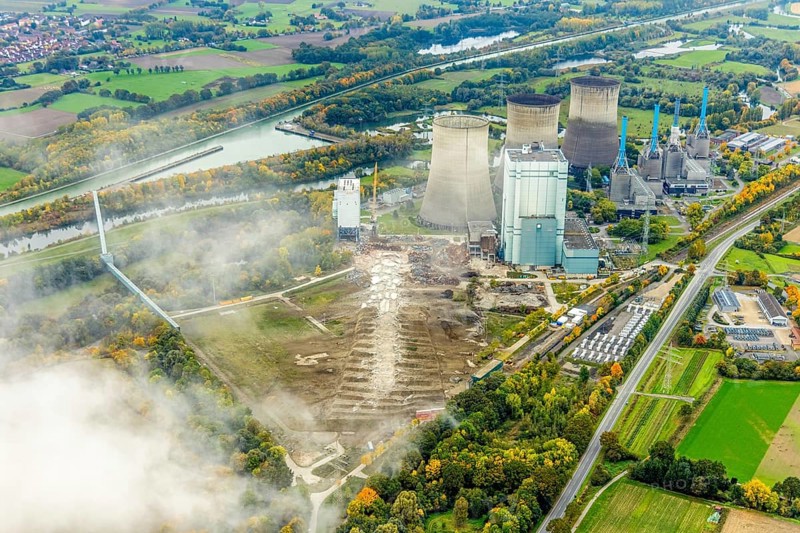 Aerial photo, thousands of spectators watched with great interest as the Gersteinwerk chimney was blown up half an hour late. The 282 metre high RWE chimney fell exactly into the prepared gravel bed. City limits of Werne, Hamm North Rhine-Westphalia, Germany