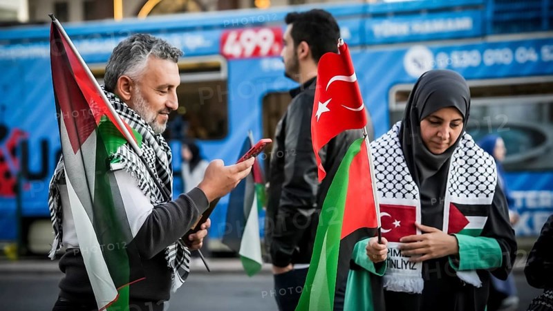 Gaziantep, Türkiye – October 11, 2025: Children and women wearing keffiyehs and carrying Palestinian flags and banners in support of Gaza participate in a massive rally following the announcement of a ceasefire, the withdrawal of Israeli forces, and a prisoner exchange between Hamas and Israel, Gaziantep, Türkiye