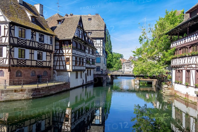 Sunny waterside impression of Strasbourg, a city at the Alsace region in France