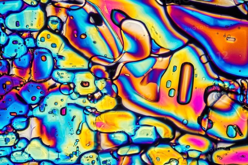 Microscopic shot showing Ammonium sulfate crystals illuminated with polarized light