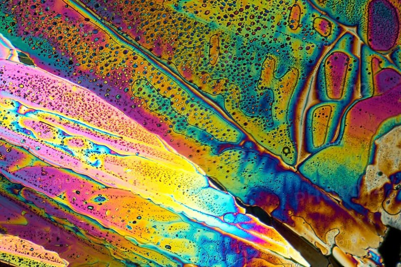 Colorful microscopic shot of Sodium acetate micro crystals in polarized light