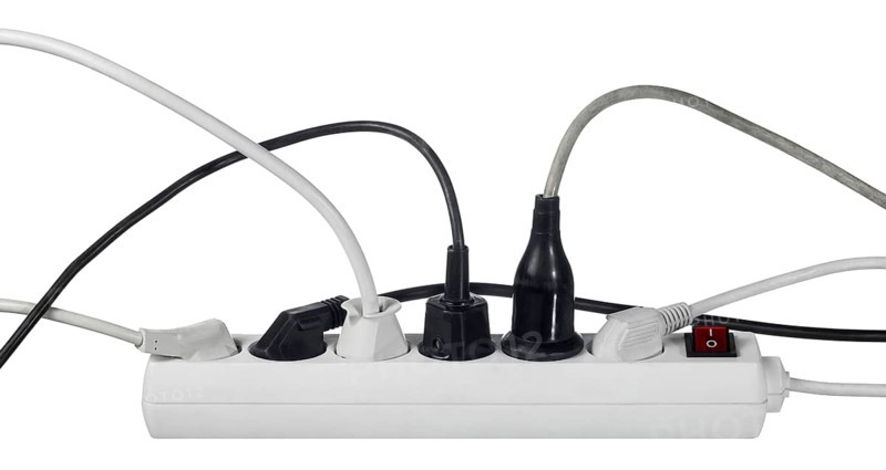 Studio photography of a multiple socket and connected plugs isolated on white with clipping path
