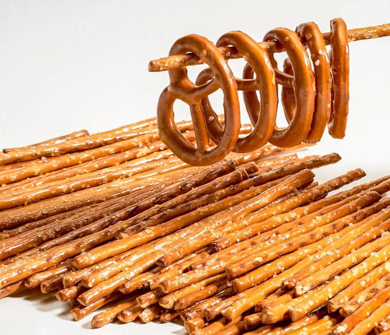 Closeup of some salt sticks and pretzels in light back