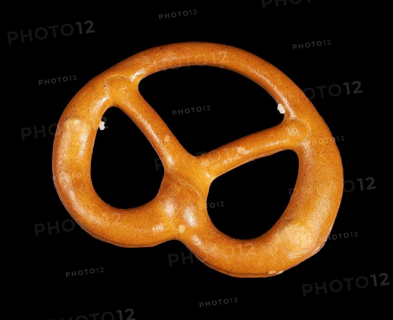 Closeup of a lye pretzel in dark back