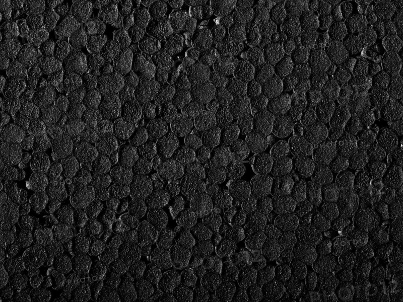 Full frame closeup of a black Polystyrene surface