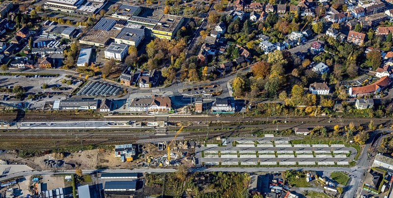 Aerial view, Haltern station, construction site conversion to a barrier-free station, Holtwicker Straße school centre, Haltern-Stadt, Haltern am See, Ruhr area, North Rhine-Westphalia, Germany, Alexander-Lebenstein-Realschule, railway tracks, railway station, station car park, construction work, construction area, construction site, building plots, construction project, construction site, education, educational institution, DE, Deutsche Bahn AG, through station, Europe, grammar school, main station, main railway station, Joseph-König-Gymnasium, teaching institute, aerial view, aerial photography, aerial photography, school, overview, conversion work, bird's-eye view, overview, autumn, autumn leaves, golden October, autumnal, Park & Ride car park, Park and Ride