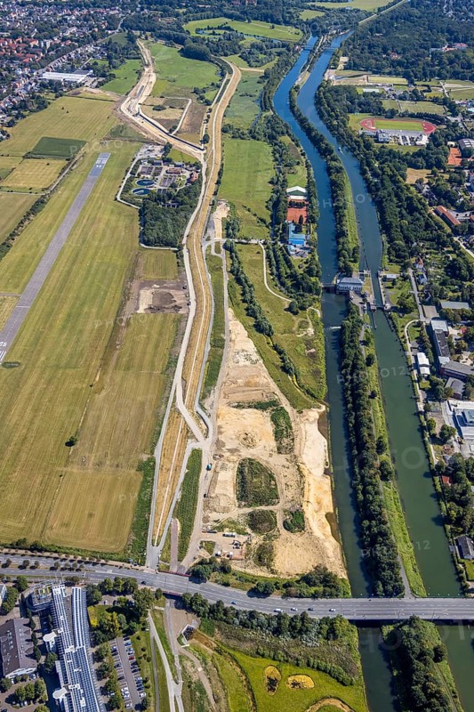 Aerial view, construction site Erlebensraum Lippeaue, Datteln-Hamm-Canal, sports fields of HTC Hockey- und Tennisclub, airfield EDLH, Hamm, shopping centre Alleecenter, Ruhr area, North Rhine-Westphalia, Germany, DE, Europe, birds-eyes, view, aerial view, aerial photography, aerial photography, overview, overview, bird's-eye view, Lippe, Hamm-Datteln-Kanal, shopping, food, clothing, consumption, consumer, technology centre, technology, company, development, waterway, shipping, transport, logistics, goods movement, ships, waters, goods, shopping, textiles, airfield, flying, air sports, leisure, pilot