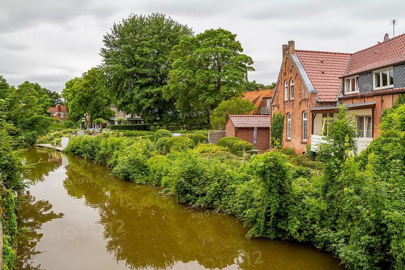 Idyllic waterside scenery in Greetsiel, a idyllic village located in East Frisia, Northern Germany